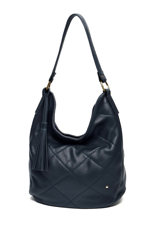 Navy quilted handbag with a tassel on a white background